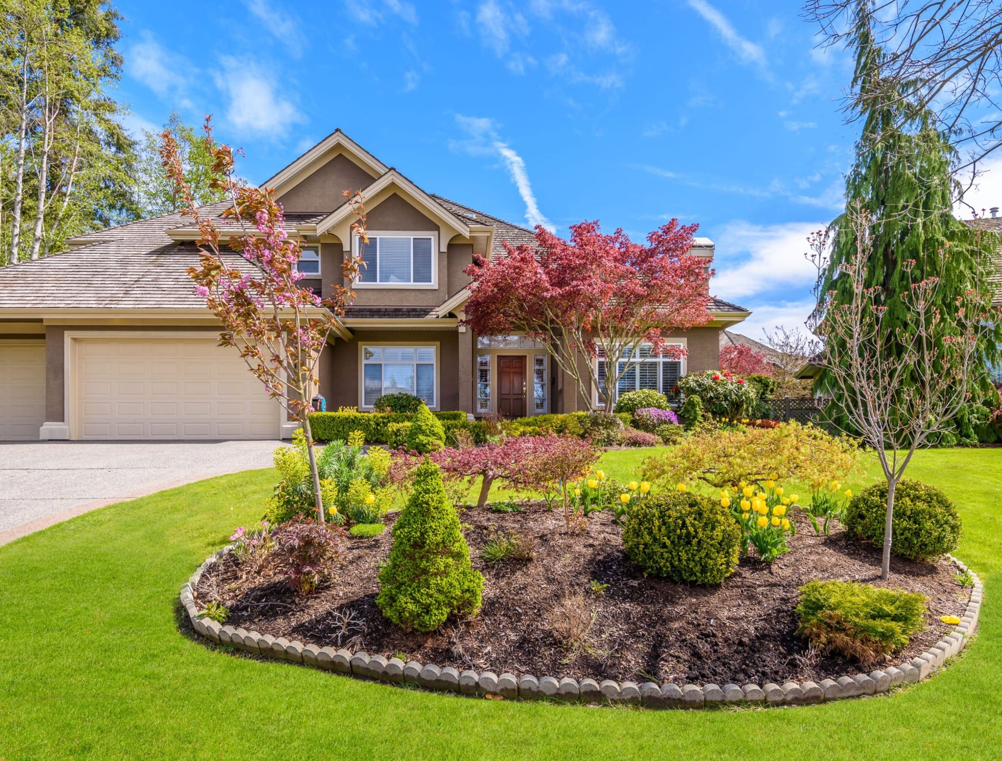 Fall yard cleanup removing leaves and debris from Edmonton front yard