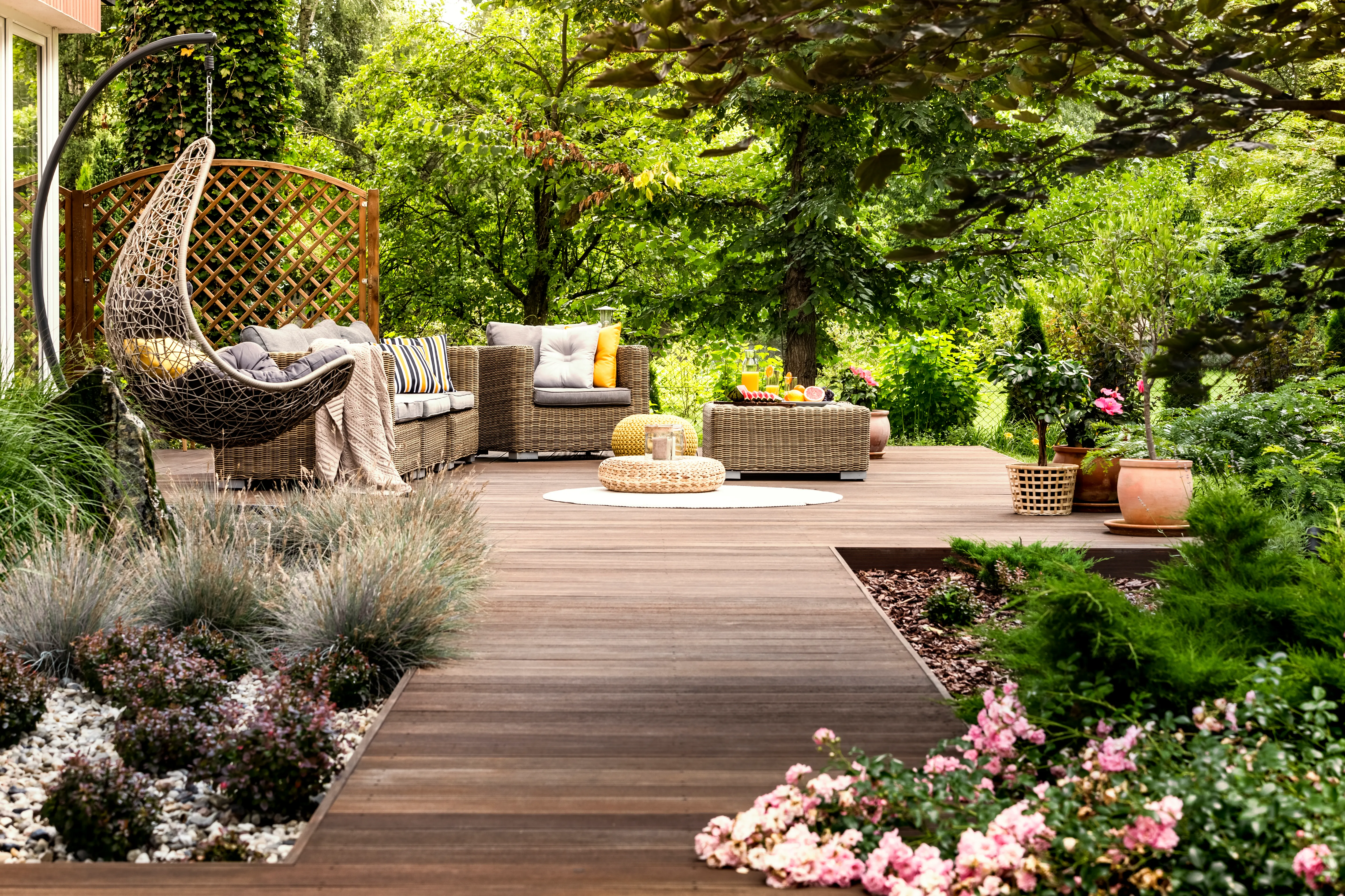 Professionally landscaped backyard in Edmonton with manicured lawn and garden beds